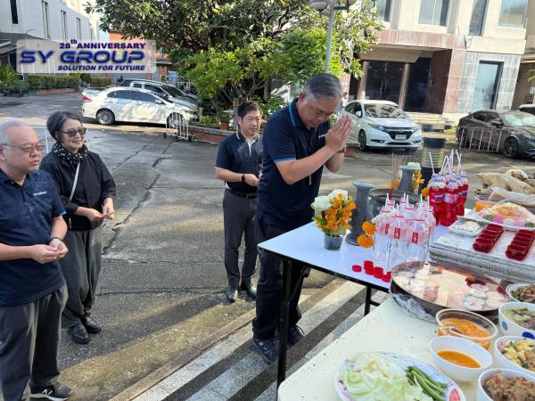 Mr. Yuttakhol, Chief Executive Director of SY Group, performing a traditional blessing ceremony for the continued success and prosperity of SY Group.