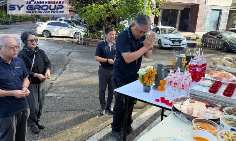 Mr. Yuttakhol, Chief Executive Director of SY Group, performing a traditional blessing ceremony for the continued success and prosperity of SY Group.